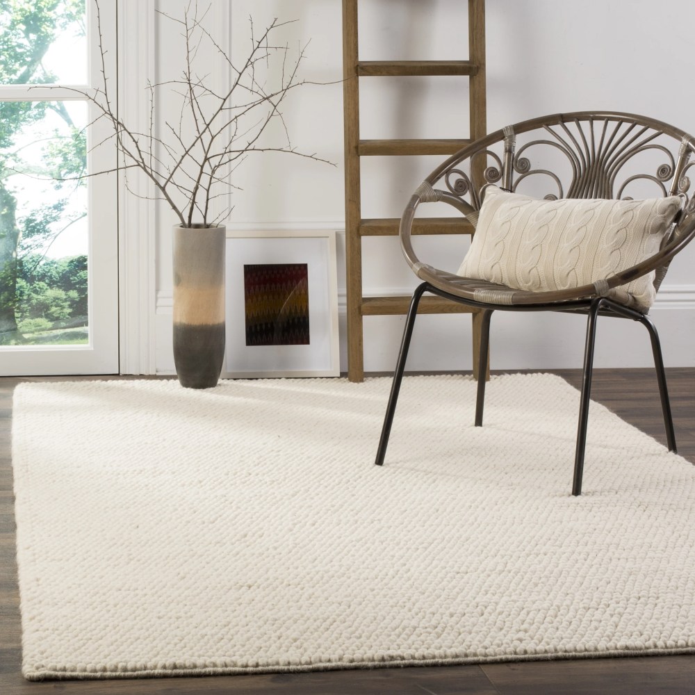 SAFAVIEH Natura Feride Solid Braided Wool Area Rug, Ivory, 6" x 9" - Scandinavian Design, Ivory, Handmade Wool Blend, Ideal for Living Room, Bedroom, Dining Space